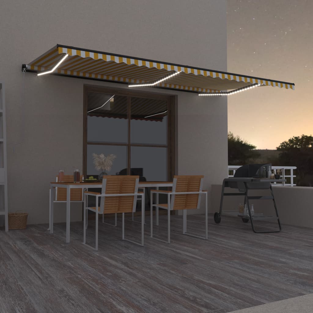 Sisäänkelattava markiisi LEDillä 600x350 cm keltavalkoinen - Sisustajankoti.fi